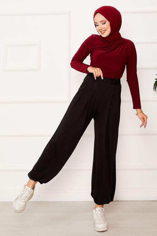 بنطلون شالوار أسود مريح بقصّة مريحة وساق مرنة