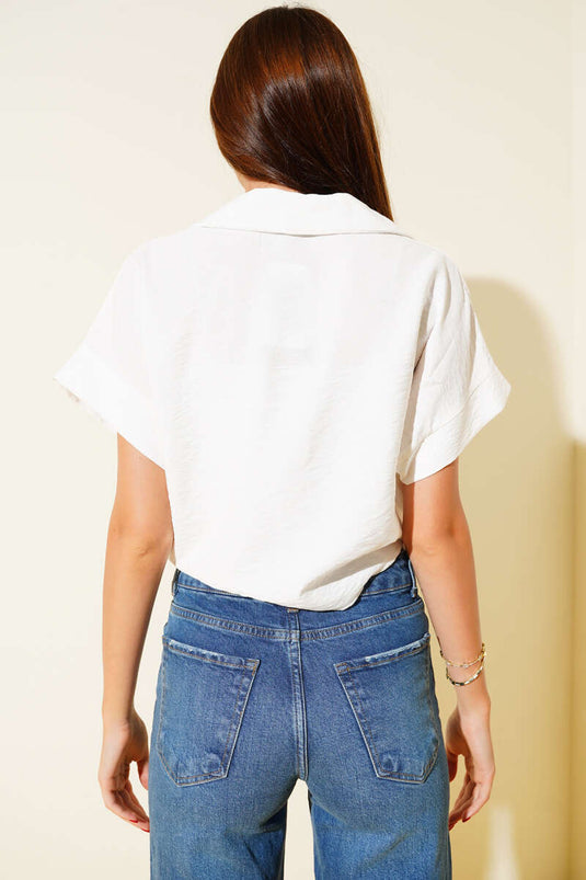 Camisa corta con bordado de margaritas, color crudo