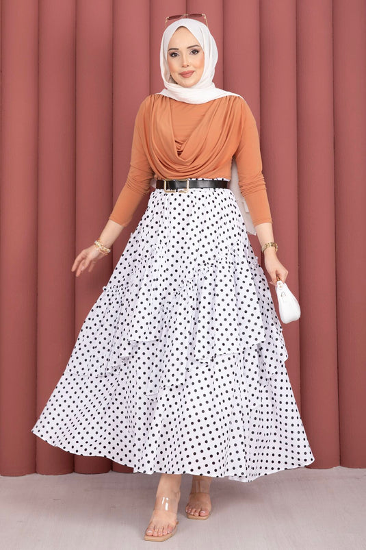 Jupe blanche à pois avec découpe asymétrique et empiècements