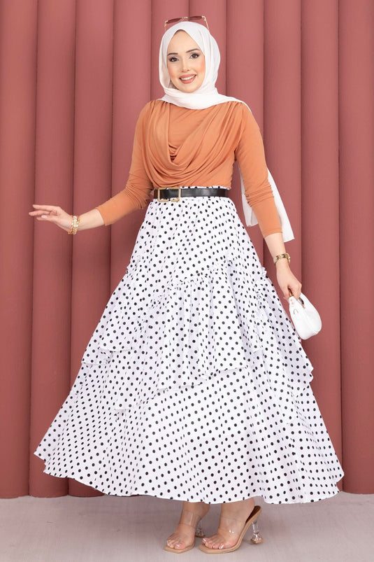 Jupe blanche à pois avec découpe asymétrique et empiècements