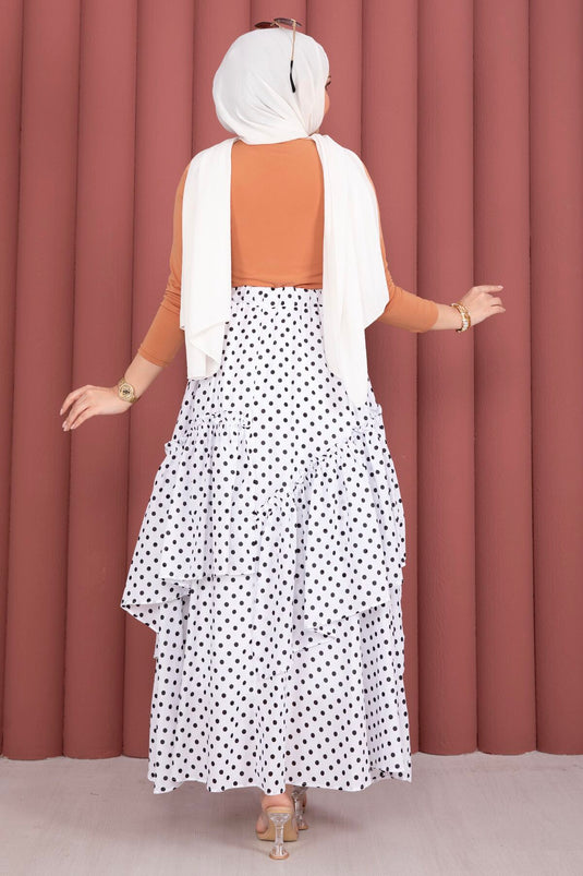 Jupe blanche à pois avec découpe asymétrique et empiècements