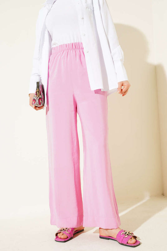 Pantalon en tissu aspect brillant rose