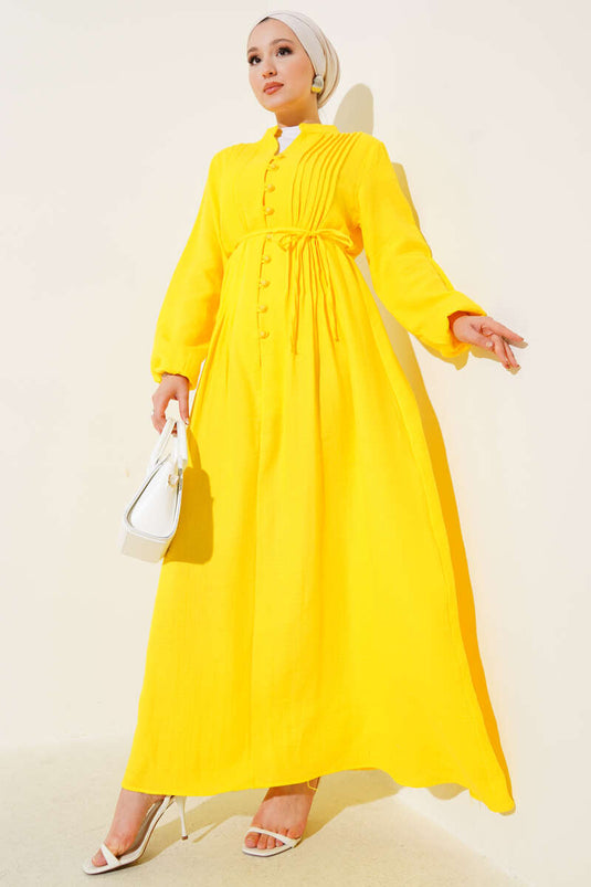 Abito plissettato con bottoni e dettagli gialli