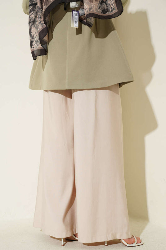 Oversize Hose mit Bundfalten und Gürtel Beige