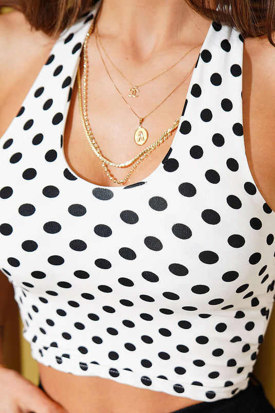 Weißes Crop-Top mit Tupfenmuster und Schlaufe am Hals