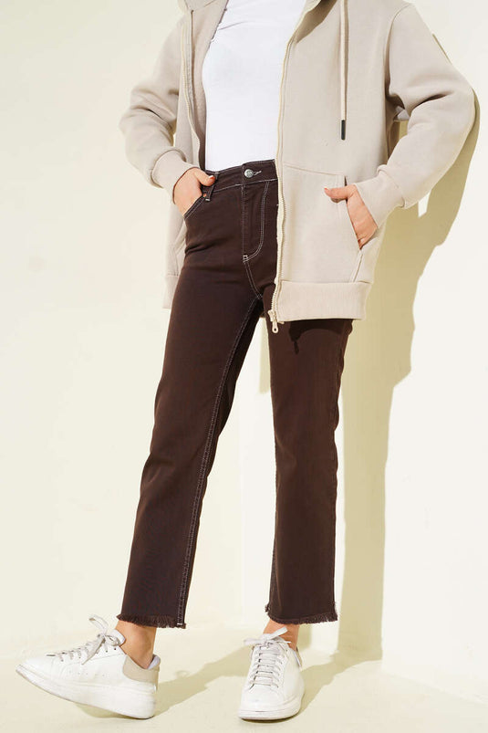 Schmale Jeanshose mit Quasten Braun