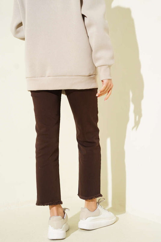 Schmale Jeanshose mit Quasten Braun