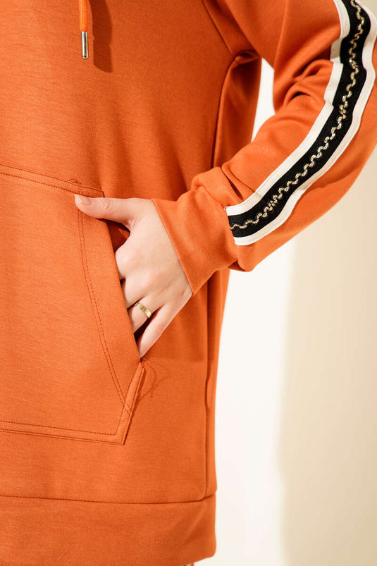 Ensemble deux pièces orange à capuche et rayures