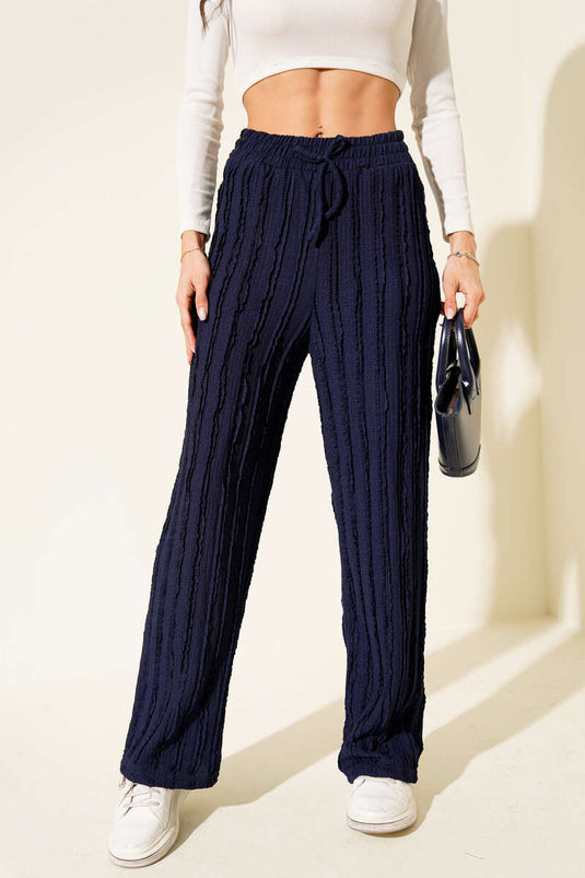 Pantalon bleu marine rayé à taille élastique et volants