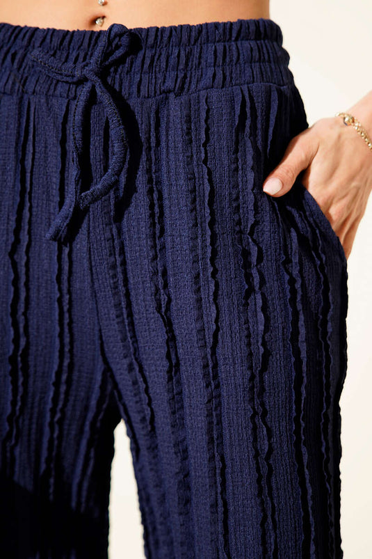 Pantalon bleu marine rayé à taille élastique et volants