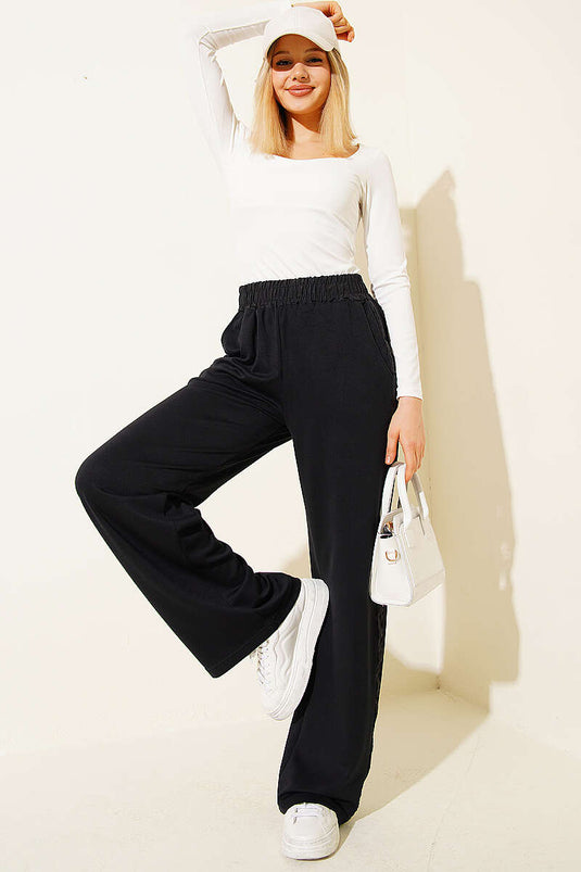 Pantaloni con elastico in vita e dettaglio a strisce neri