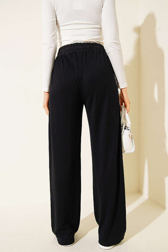 Pantaloni con elastico in vita e dettaglio a strisce neri