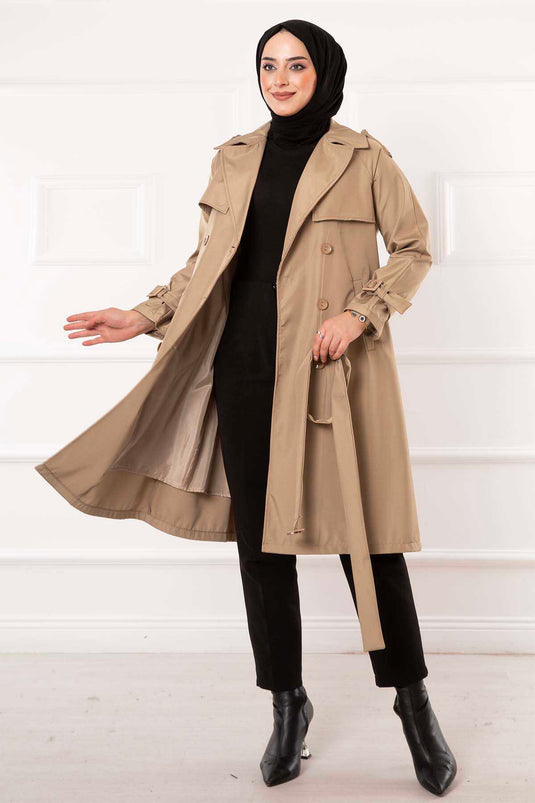 Vison détaillé de trench avec bouton ceinturé mobile