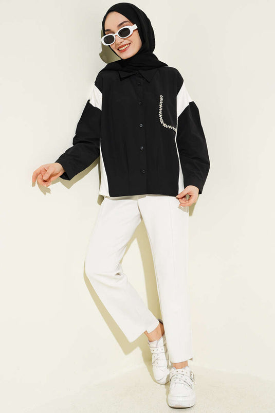 Chemise noire avec détails en pierre et garniture