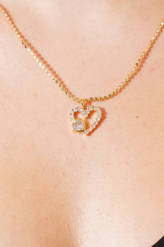 Collier en or orné d'un cœur et de pierres