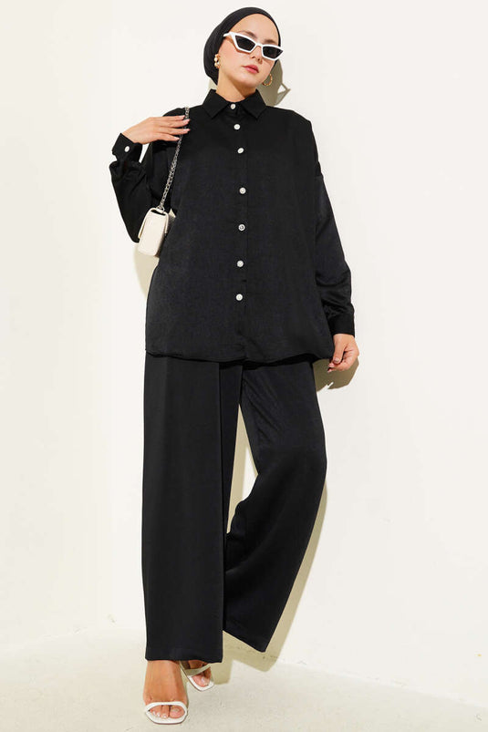 Costume deux pièces noir avec boutons en pierre