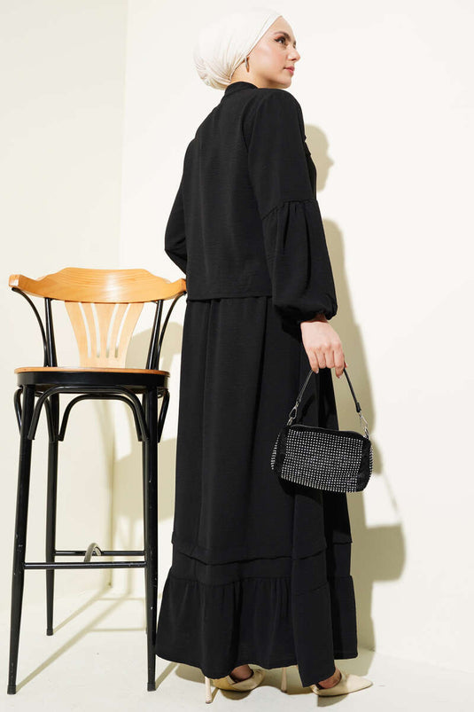 Abito due pezzi con gonna a balze e bottoni in pietra, nero