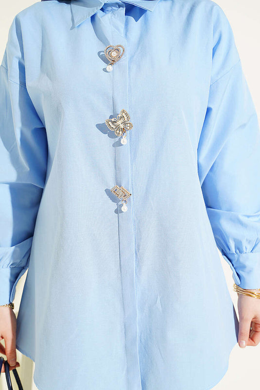 Blue Shirt with Hidden Buttons and Jeweled Brooch