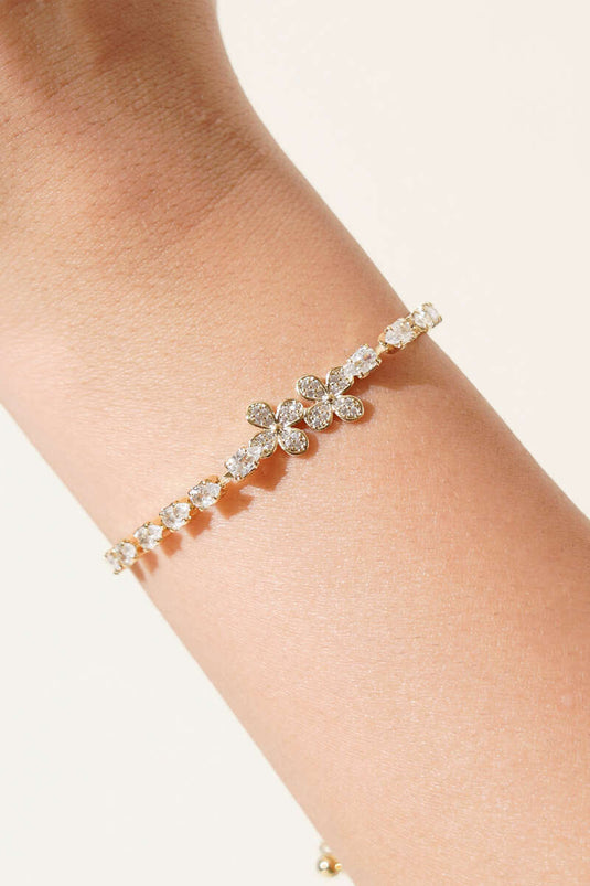 Pulsera con figura de flor con piedras dorada