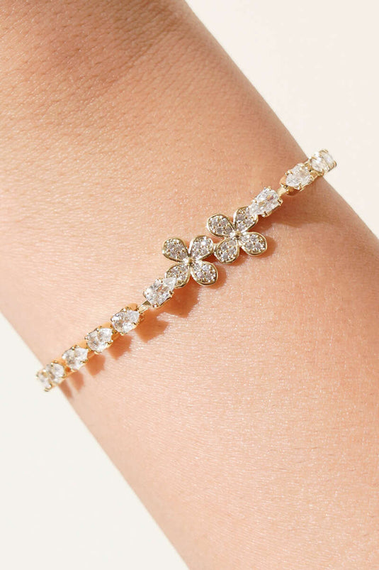 Pulsera con figura de flor con piedras dorada