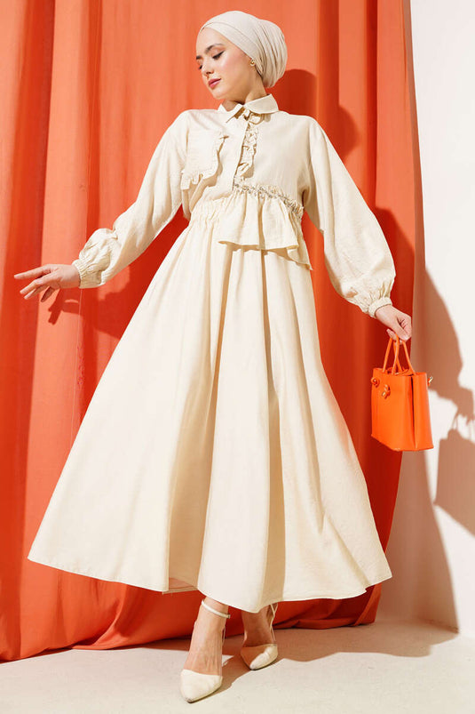 Ensemble deux pièces à volants et jupe beige