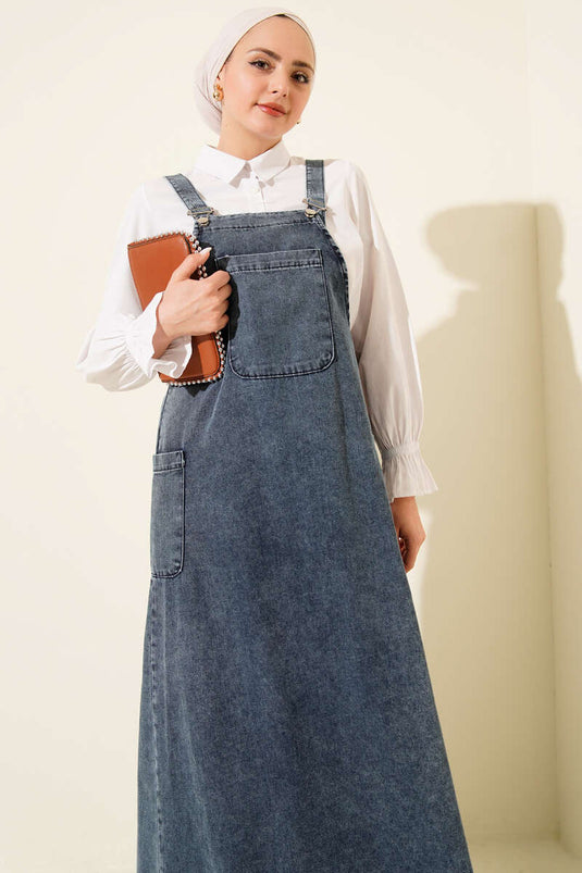 فستان دنيم بحمالات وجيب واحد باللون الأزرق الفاتح