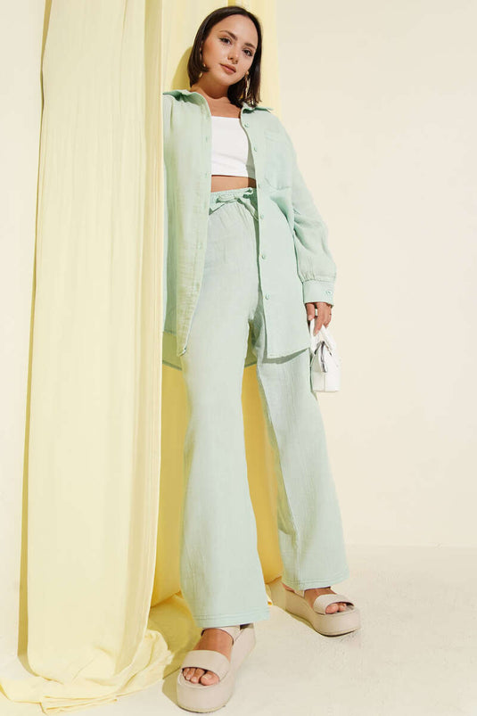 Set due pezzi in mussola con tasca singola, colore menta