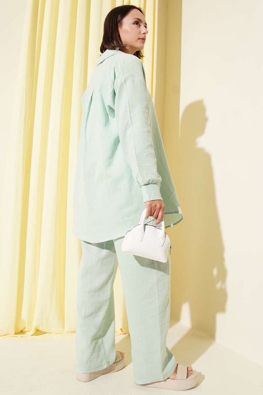 Set due pezzi in mussola con tasca singola, colore menta