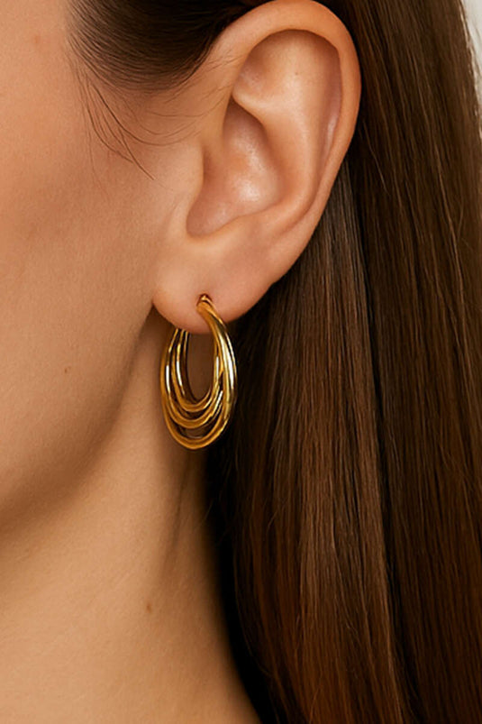 Oorbellen met drie ringen, goudkleurig.