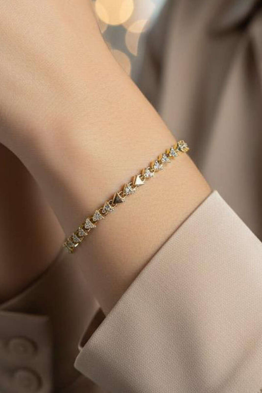 سوار مثلث مزين بالأحجار ذهبي