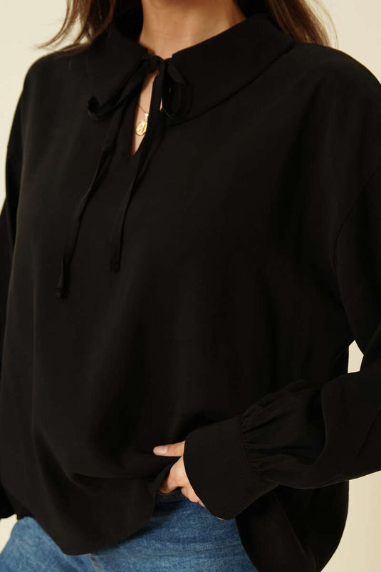 بلوزة تينسل بأكمام طويلة وياقة على شكل حرف V باللون الأسود