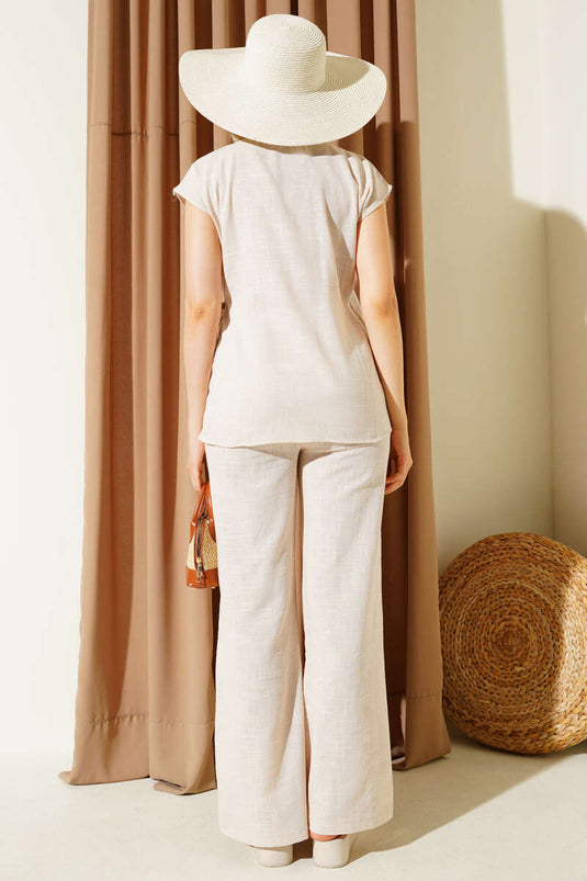 Ensemble deux pièces en lin beige, col en V et liens sur le côté