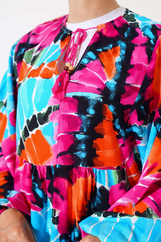 فستان بأكمام الخفاش وياقة برباط باللون الفوشيا