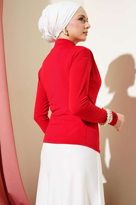 Chemisier rouge Sandy à col roulé froncé sur le côté