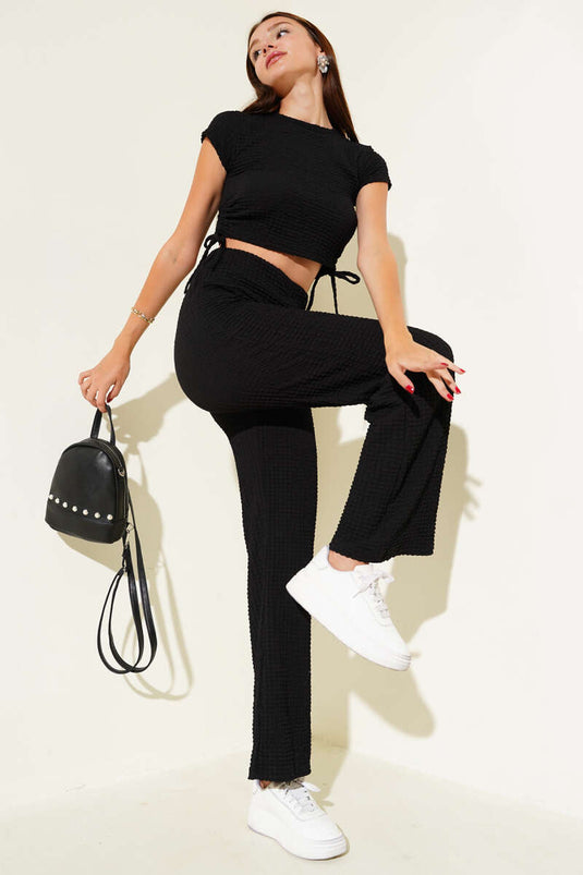 Tweedelige crop top met wafelstructuur en plooien aan de zijkant, zwart