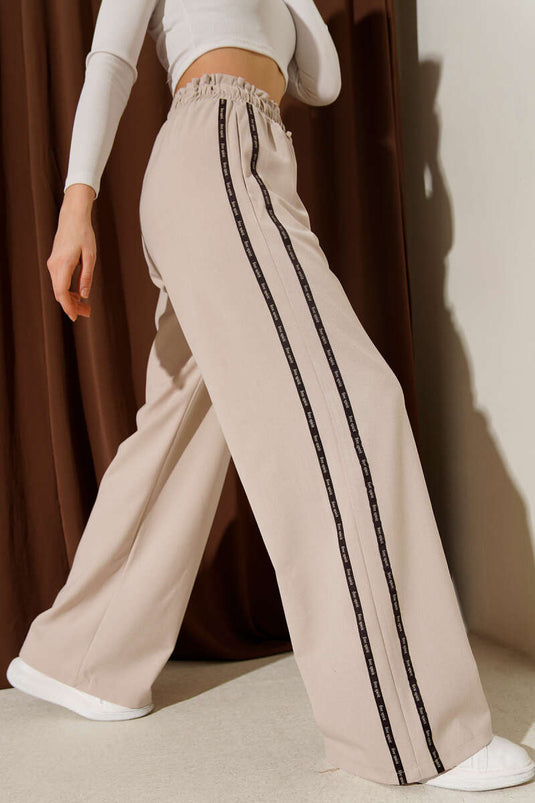 Pantalon Palazzo beige à taille élastique avec bande latérale contrastante