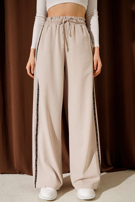 Pantalon Palazzo beige à taille élastique avec bande latérale contrastante