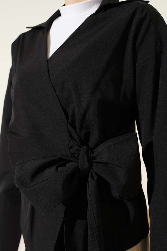 Blouse noire à nouer sur le côté