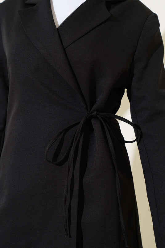 Veste noire à double boutonnage et fermeture latérale