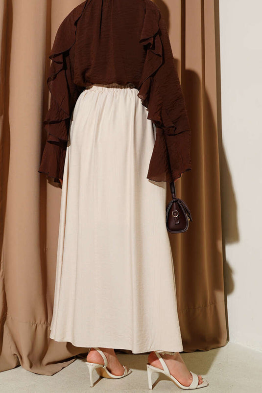 تنورة واسعة بتفاصيل جيب جانبي بلون بيج