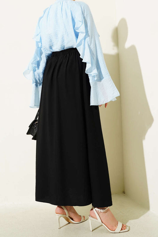 Jupe évasée noire avec détails latéraux de poche