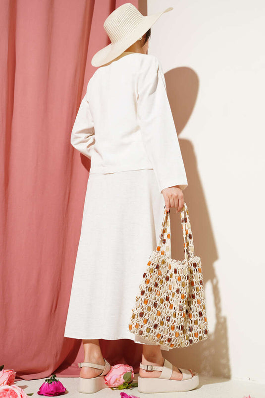 طقم من قطعتين من الكتان مع تنورة جانبية برباط من الحجر