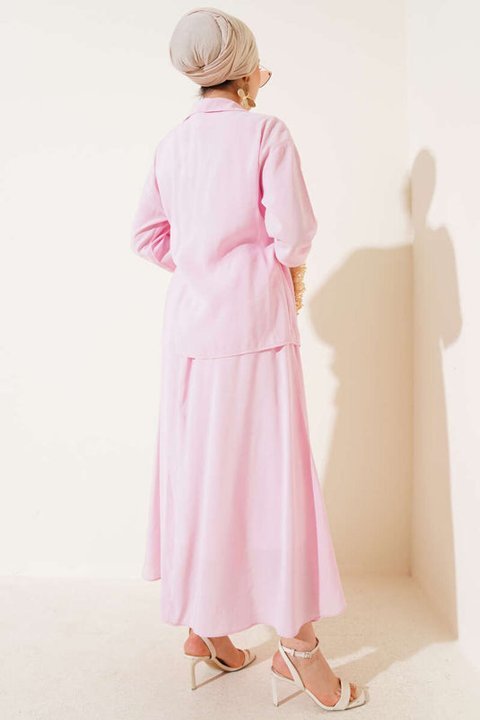 Ensemble deux pièces avec jupe à nouer sur le côté, rose