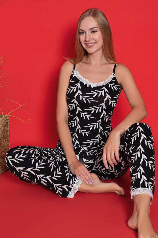Ensemble pyjama noir à bretelles en dentelle et motif de feuilles