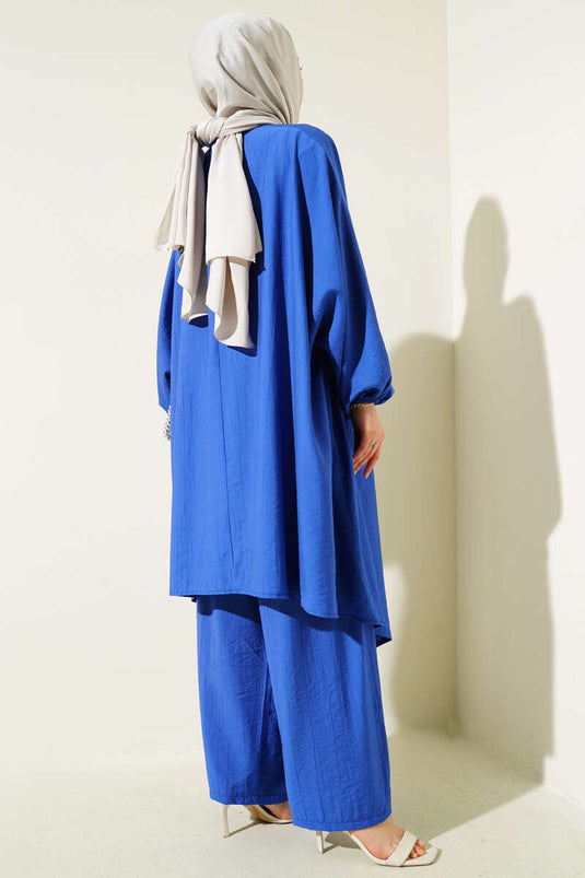 بدلة مكونة من قطعتين بأكمام خفاش وقصّة غير متماثلة من ساكسفون