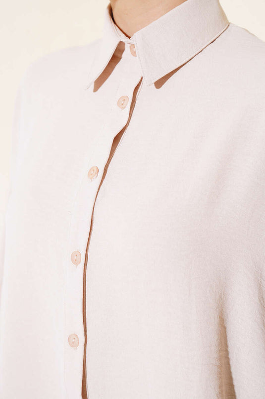 بدلة مزدوجة بأكمام الخفاش وأزرار باللون البيج