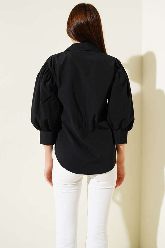 Chemise noire à manches demi-ballon