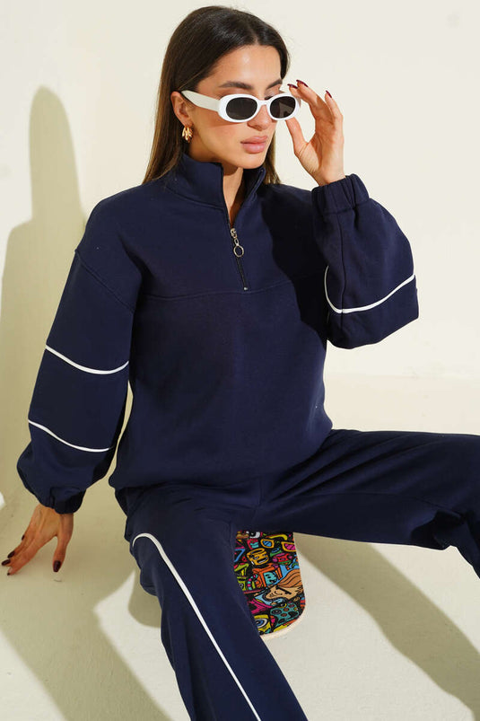 طقم مزدوج من ثلاثة خيوط مع حاشية وسحاب نصف طويل باللون الأزرق الداكن