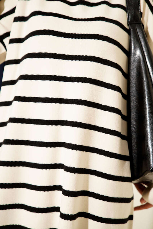 Túnica básica de punto con detalle de línea horizontal color marfil