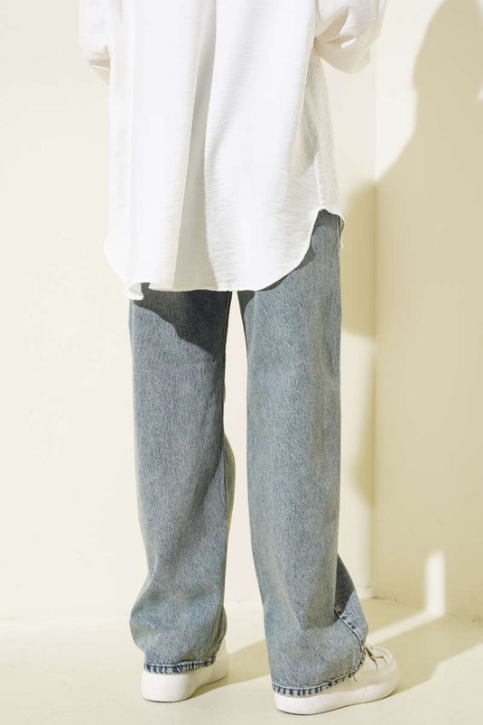 بنطلون جينز فضفاض مغسول باللون الأزرق